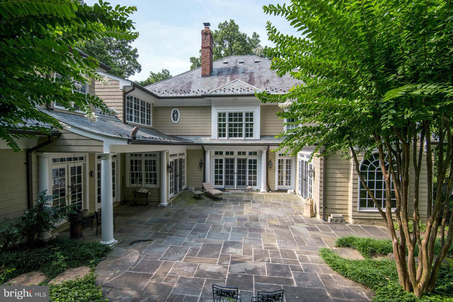 7414 Dulany Drive McLean, VA 22101 - Photo 25 of 30 a front view of a house with a garden