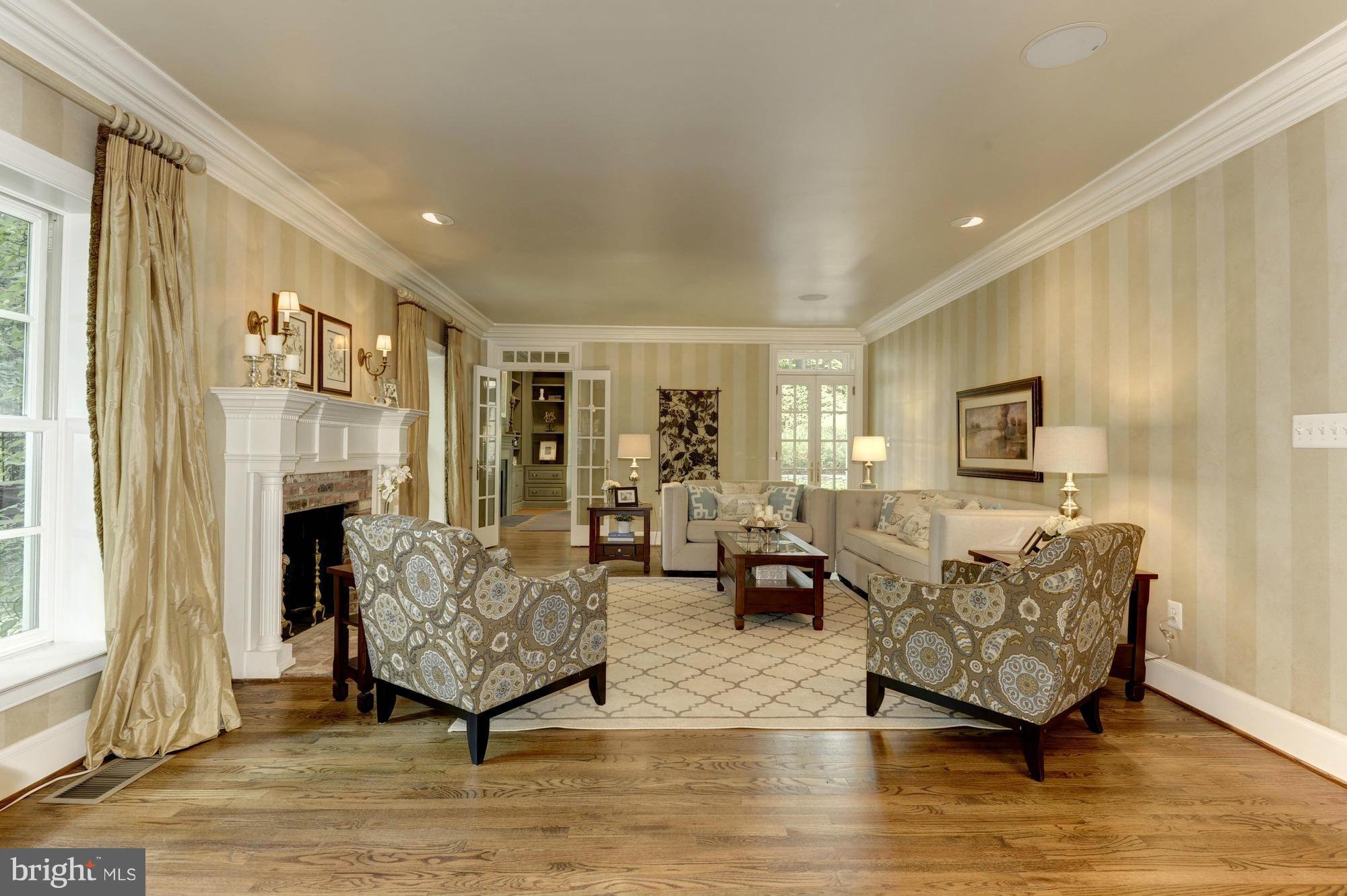 7414 Dulany Drive McLean, VA 22101 - Photo 6 of 30 a living room with fireplace furniture and a window