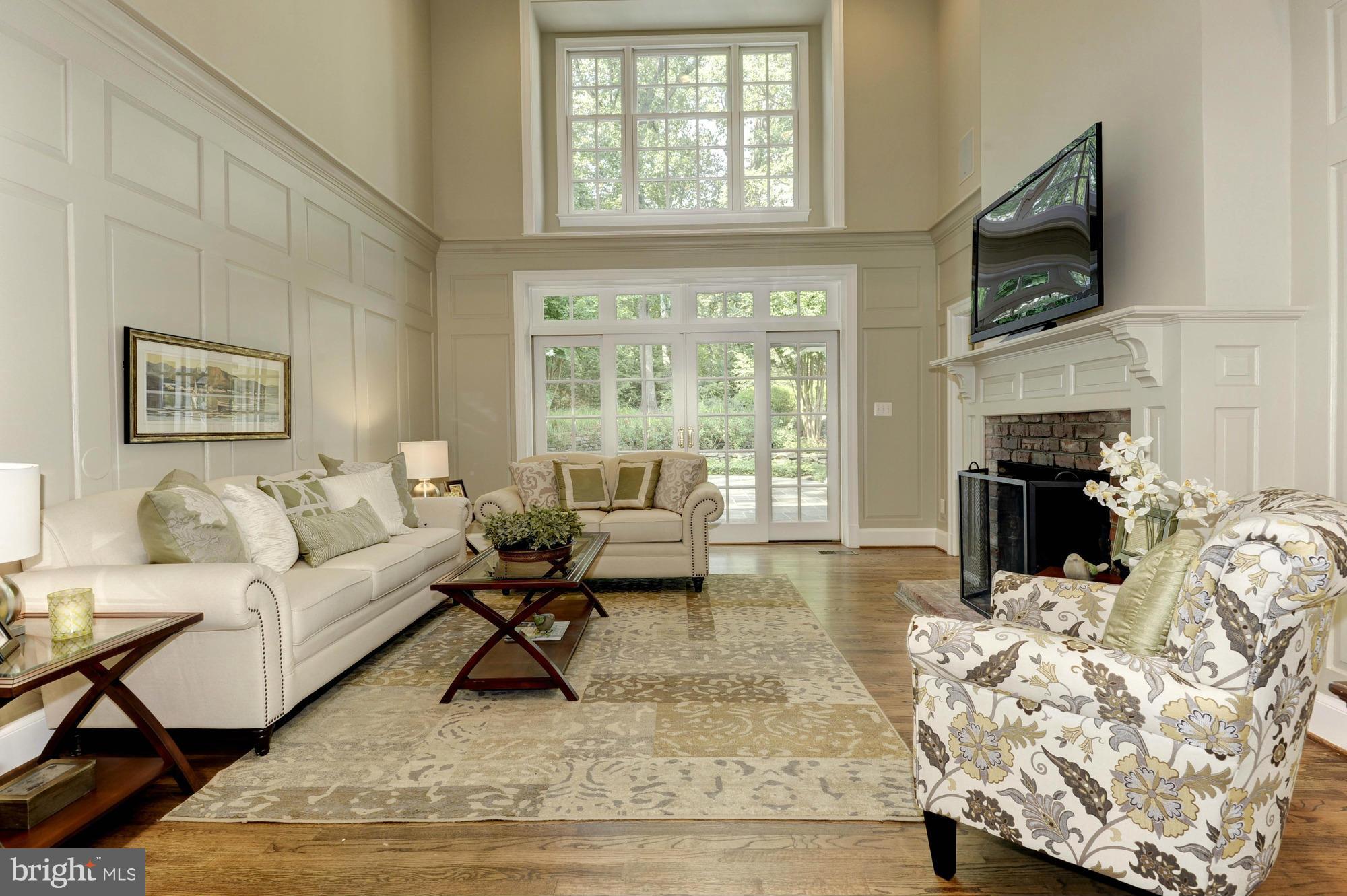 7414 Dulany Drive McLean, VA 22101 - Photo 8 of 30 a living room with furniture fireplace and a flat screen tv