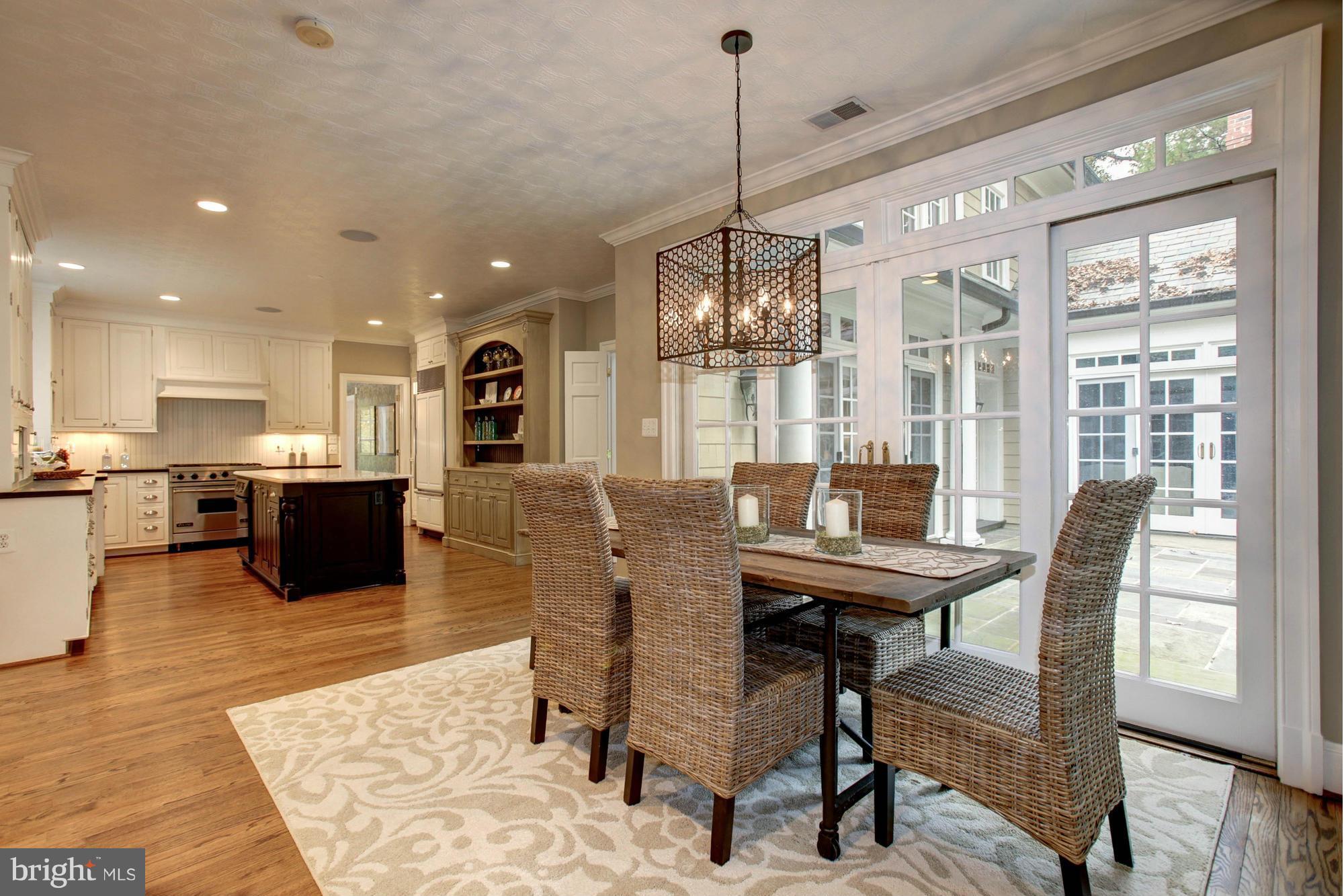 7414 Dulany Drive McLean, VA 22101 - Photo 10 of 30 a view of a dining room with furniture window and wooden floor