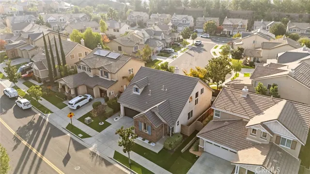 an aerial view of a house with a yard