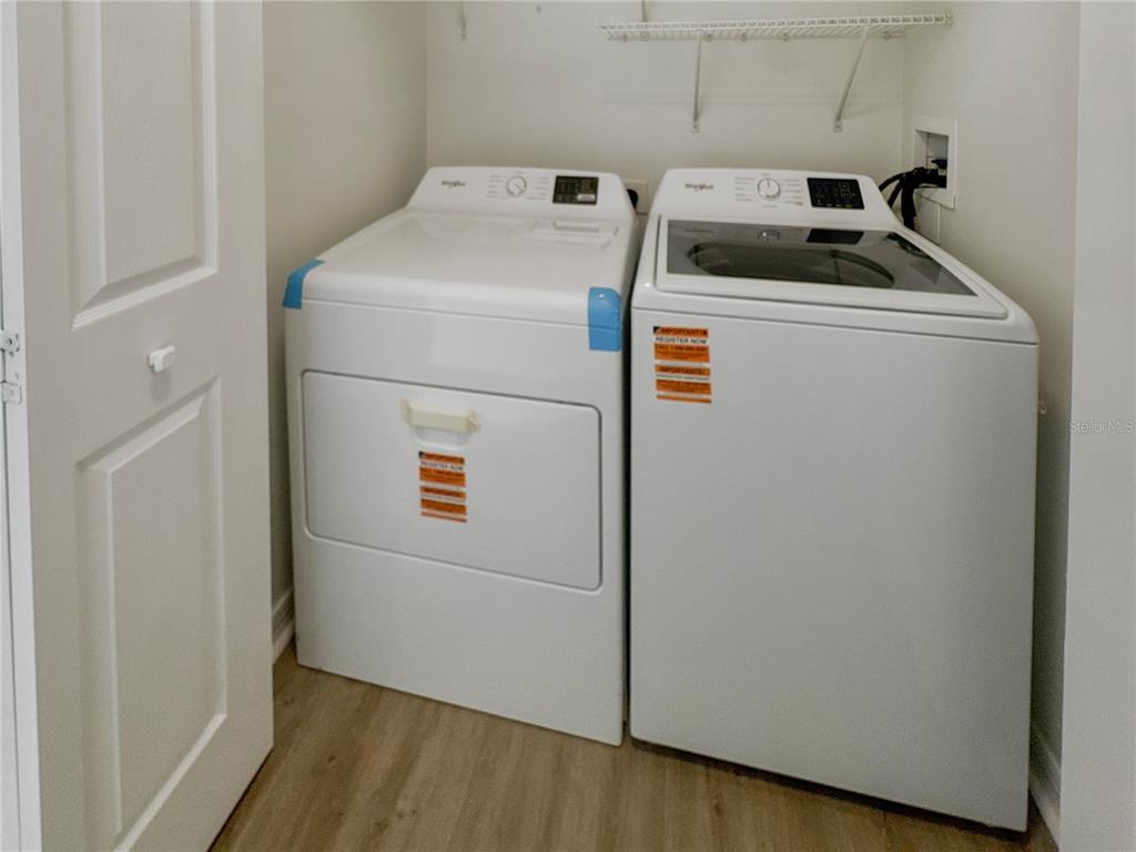 2109 Aitkin Loop Leesburg, FL 34748 - Photo 14 of 33 a utility room with dryer and washer