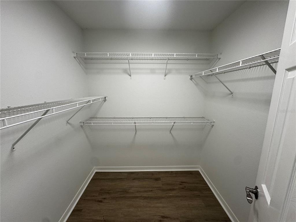 2109 Aitkin Loop Leesburg, FL 34748 - Photo 24 of 33 a view of a room with racks on the wall