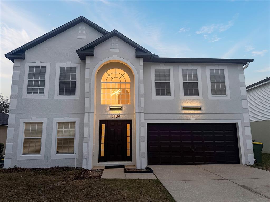 2109 Aitkin Loop Leesburg, FL 34748 - Photo 28 of 33 a front view of a house with a porch