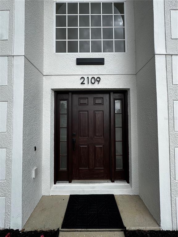 2109 Aitkin Loop Leesburg, FL 34748 - Photo 33 of 33 a view of a door with a window