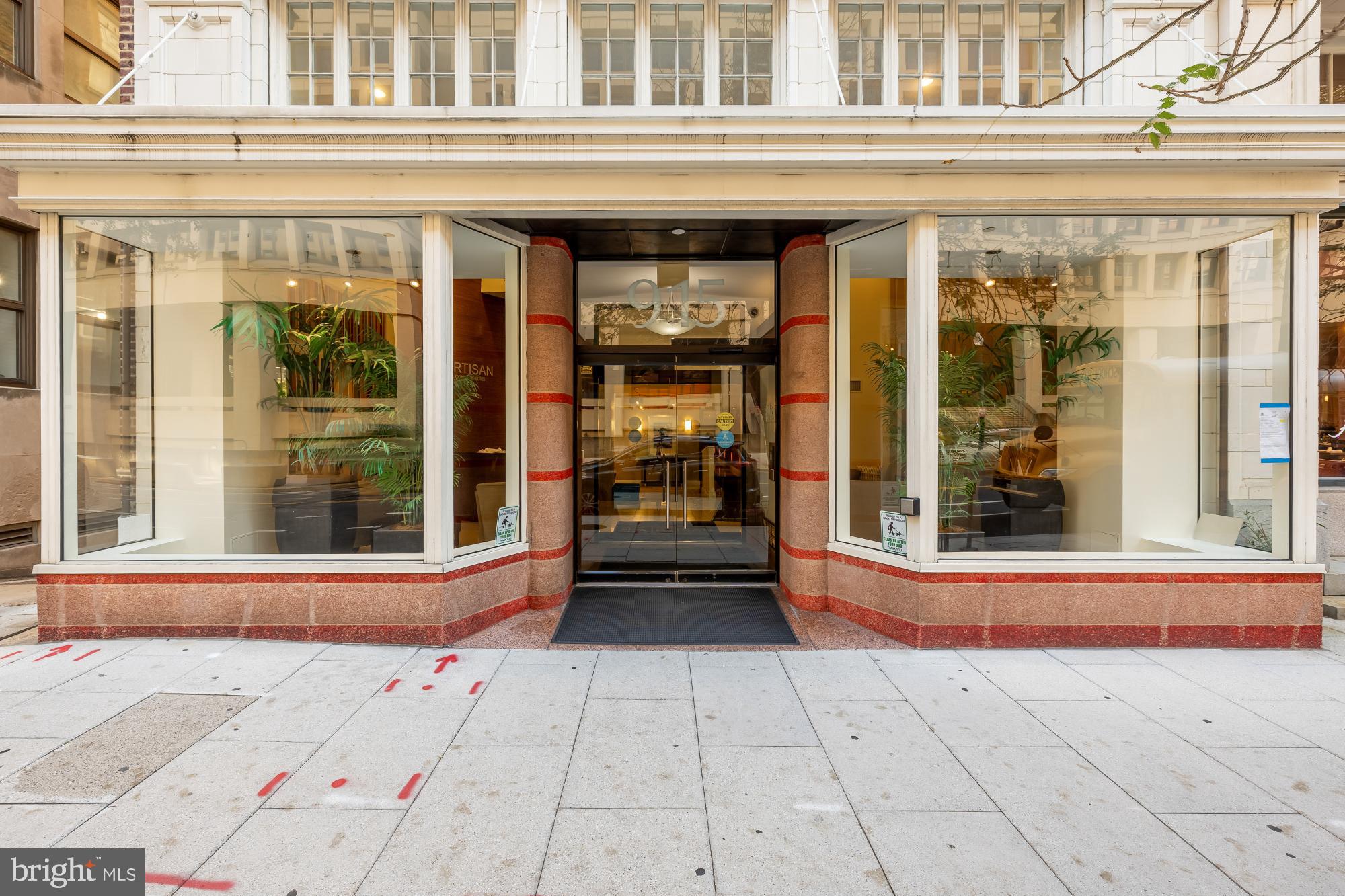 915 E Street Northwest, Unit 815 Washington, DC 20004 - Photo 4 of 26 Inviting entrance with modern glass facade.