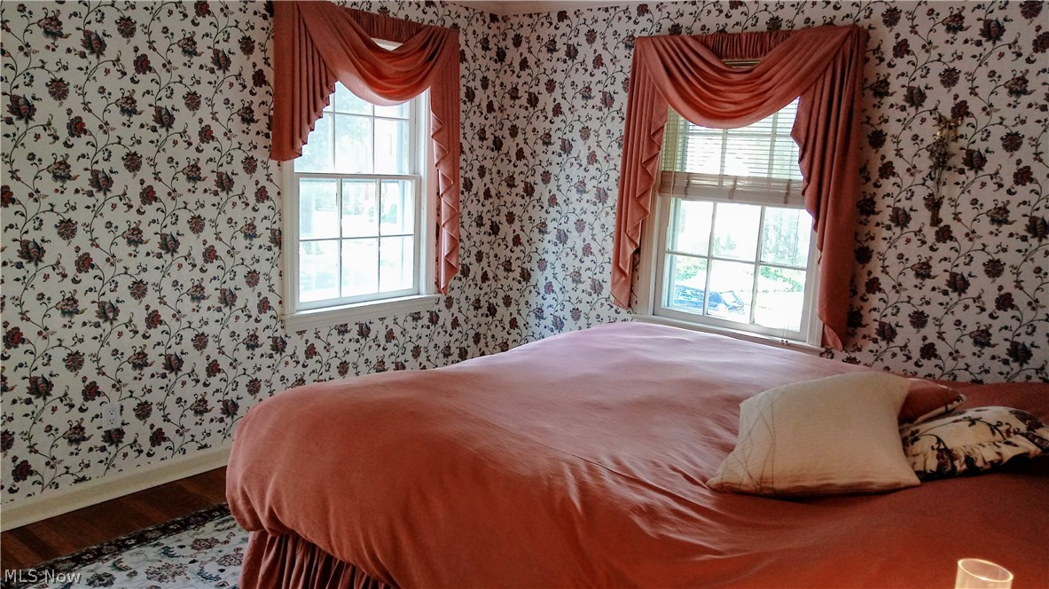 4181 Bushnell Road University Heights, OH 44118 - Photo 13 of 22 Master bedroom has his and her closets, beautiful hardwood floors and plenty of natural light.