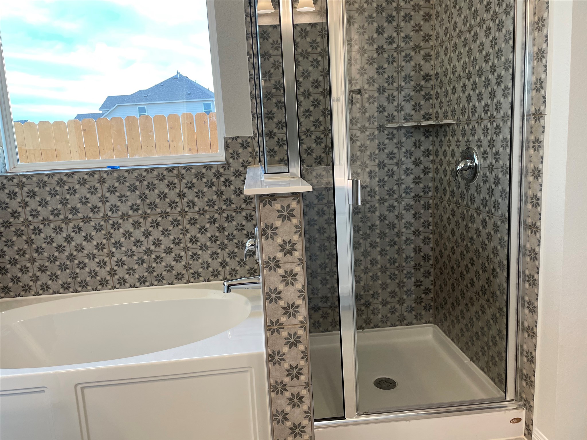 3908 Birdwatch Loop, Unit 56 Pflugerville, TX 78660 - Photo 21 of 30 a bathroom with a bathtub and a shower