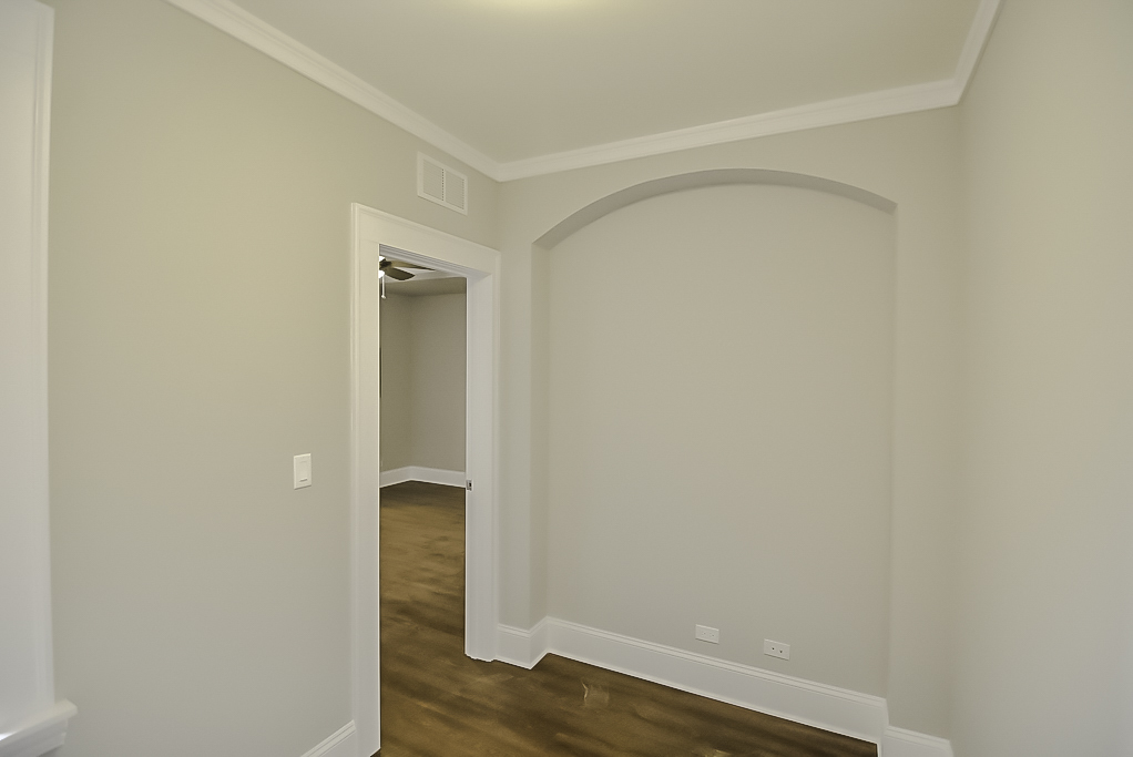 817 West Lakeside Place, Unit 705 Chicago, IL 60640 - Photo 13 of 19 a view of an empty room with wooden floor and closet