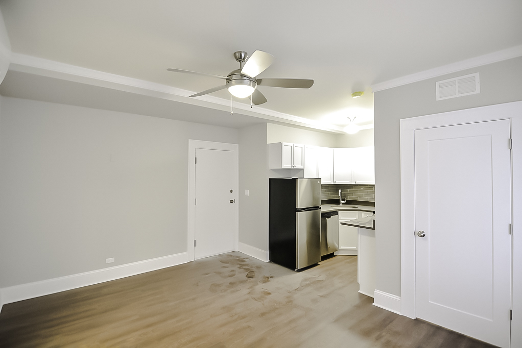 817 West Lakeside Place, Unit 705 Chicago, IL 60640 - Photo 8 of 19 a view of a kitchen with a sink refrigerator and wooden floor