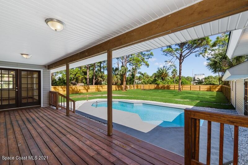 1667 Emmaus Road Northwest Palm Bay, FL 32907 - Photo 14 of 25 Back deck Porch Pool