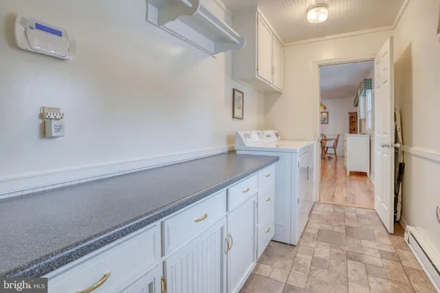a spacious bathroom with a sink and a mirror