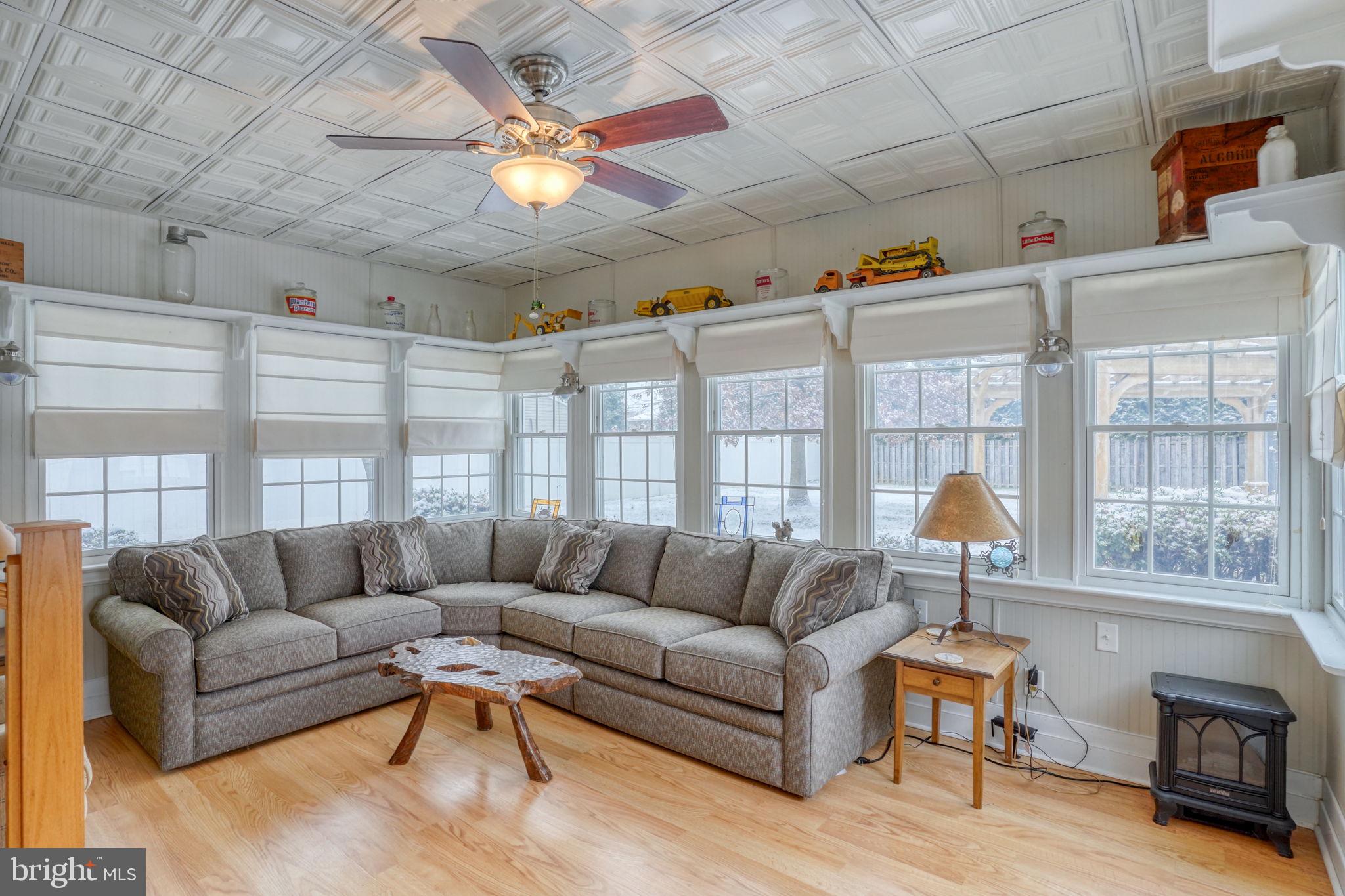 131 Rodric Terrace Dover, DE 19901 - Photo 15 of 45 a living room with furniture a ceiling fan and a window