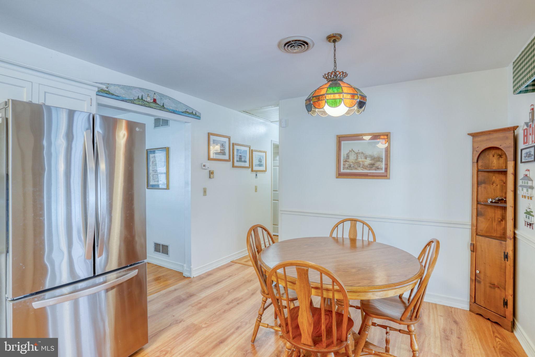 131 Rodric Terrace Dover, DE 19901 - Photo 34 of 45 a view of a dining room with furniture wooden floor and a window