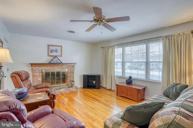 a bedroom with a bed and glass windows