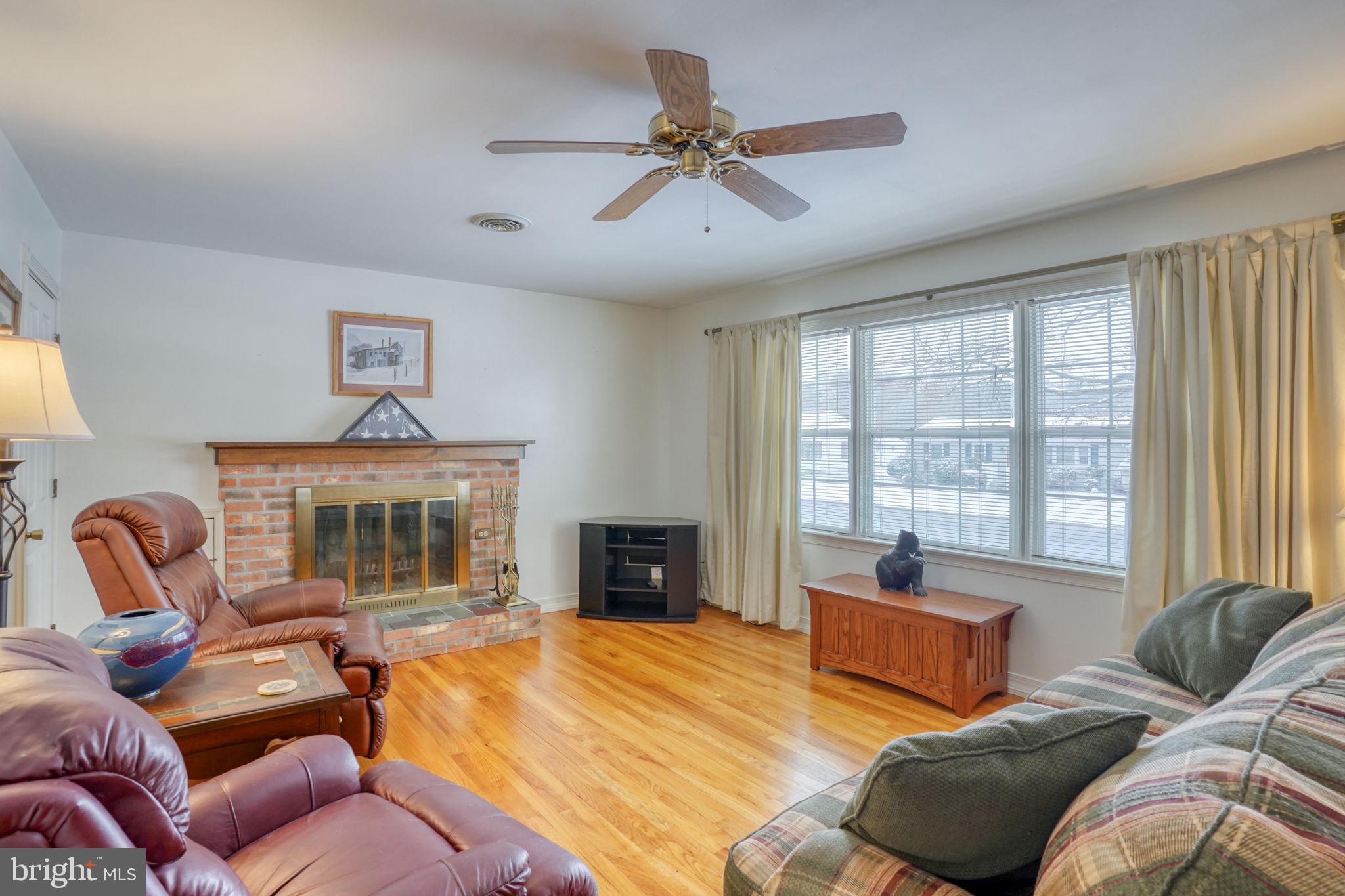 131 Rodric Terrace Dover, DE 19901 - Photo 4 of 45 a bedroom with a bed and glass windows