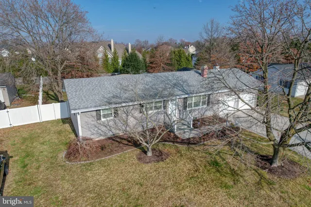 an aerial view of residential house with outdoor space
