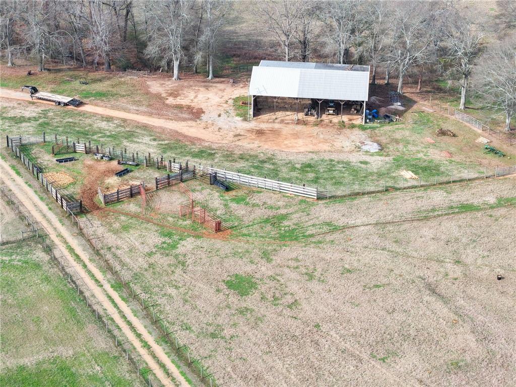 31 Old Harden Bridge Road Southwest Taylorsville, GA 30178 - Photo 65 of 103 a backyard of a house with table and chairs