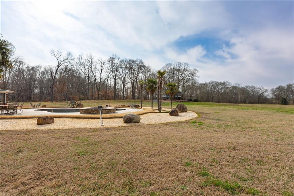 31 Old Harden Bridge Road Southwest Taylorsville, GA 30178 - Photo 94 of 103 a view of swimming pool with a yard and outdoor seating