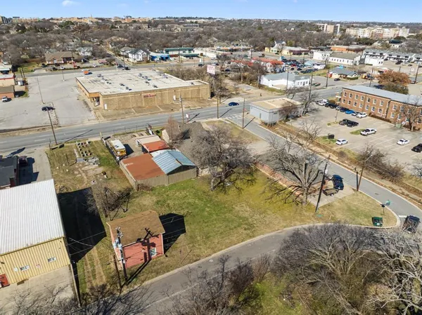 aerial view of a house with a yard