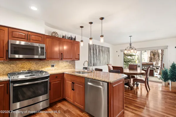 a kitchen with lots of counter top space and dining table