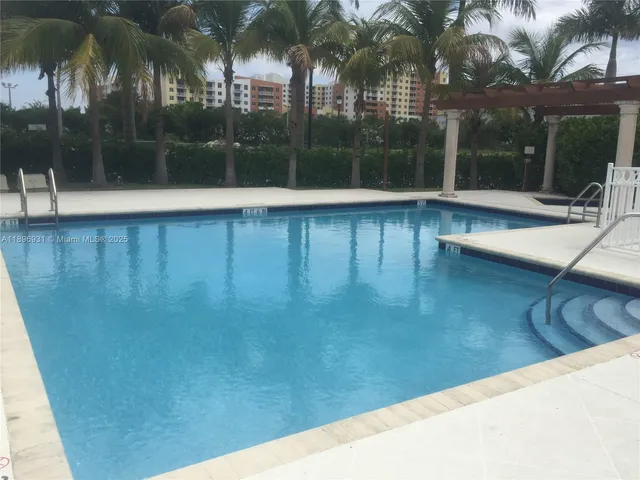 a view of a swimming pool with a patio