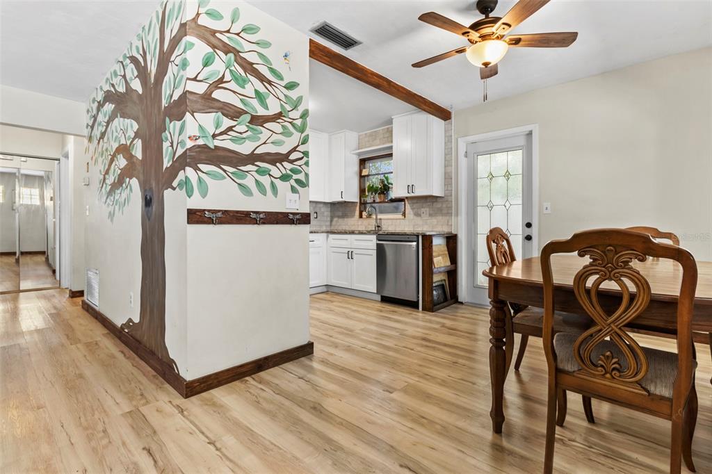 6221 Dalton Street Spring Hill, FL 34606 - Photo 24 of 40 a view of a dining room with furniture and chandelier