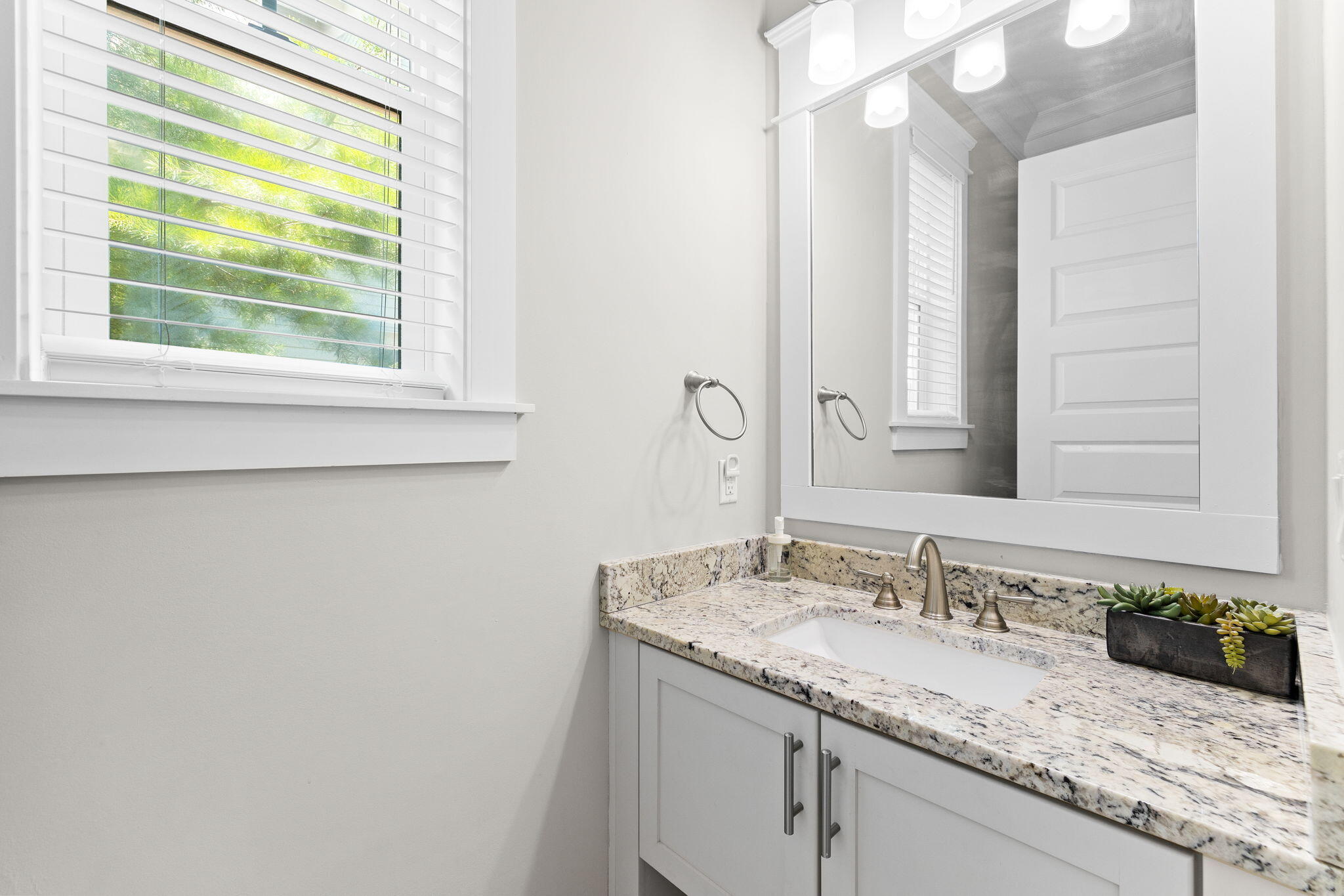 19 West Chester Street Inlet Beach, FL 32461 - Photo 16 of 49 a bathroom with a granite countertop sink and a mirror