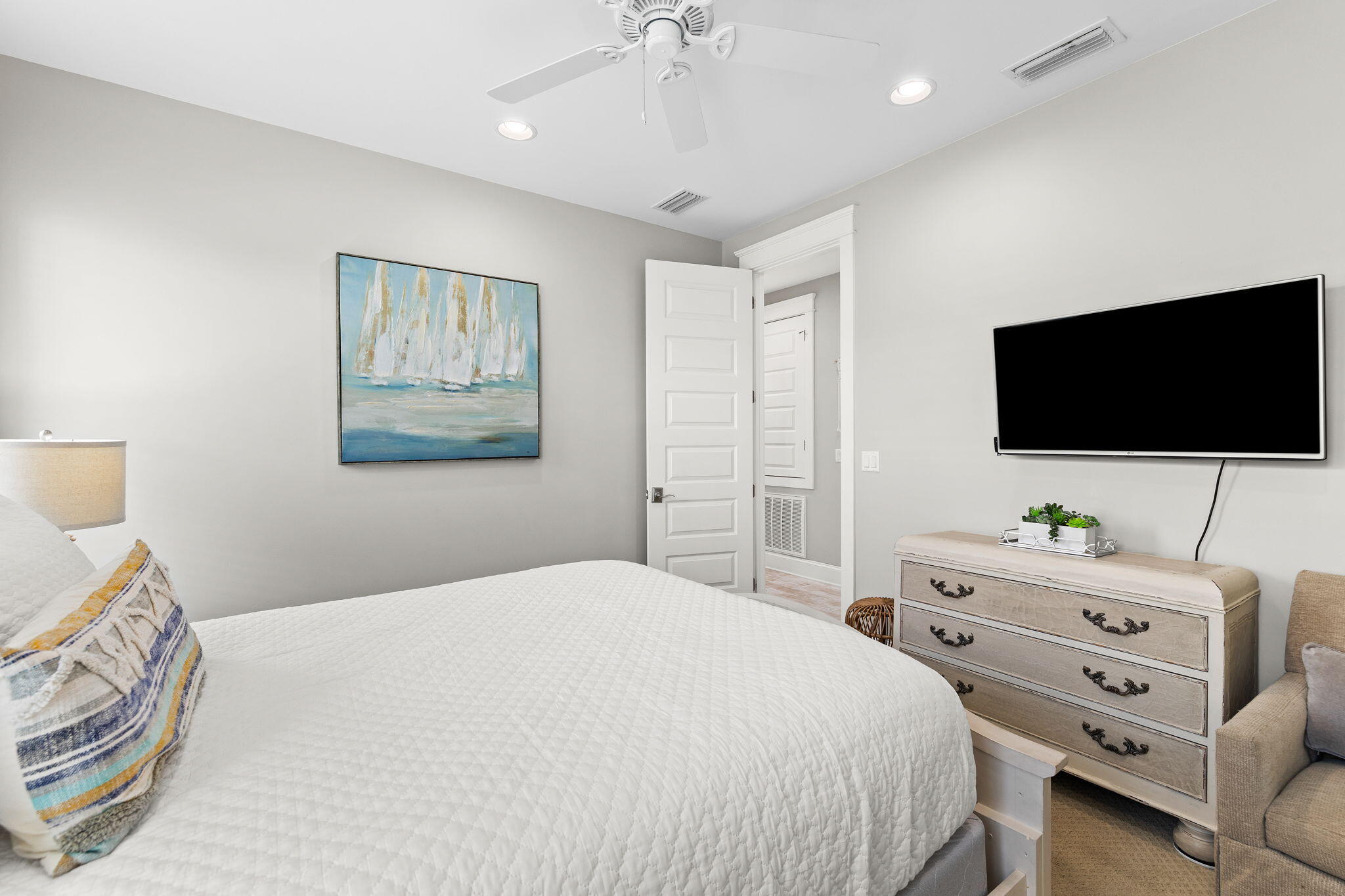 19 West Chester Street Inlet Beach, FL 32461 - Photo 22 of 49 a bedroom with a bed and a flat screen tv