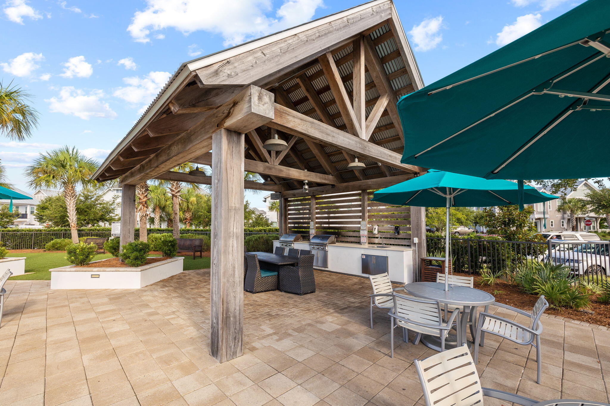 19 West Chester Street Inlet Beach, FL 32461 - Photo 44 of 49 a view of a patio with a table and chairs under an umbrella