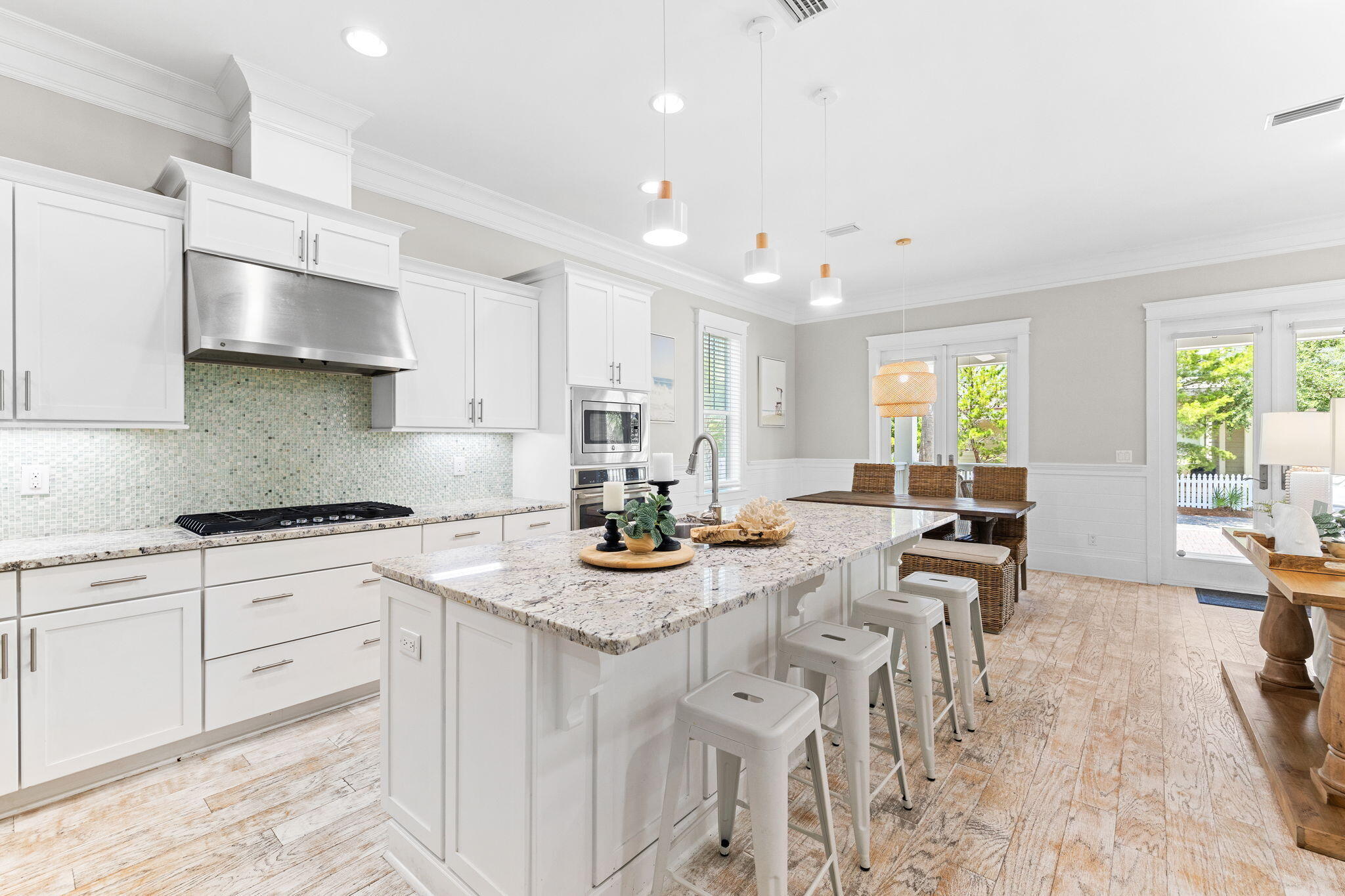 19 West Chester Street Inlet Beach, FL 32461 - Photo 8 of 49 a kitchen with stainless steel appliances granite countertop a stove a sink a dining table and chairs