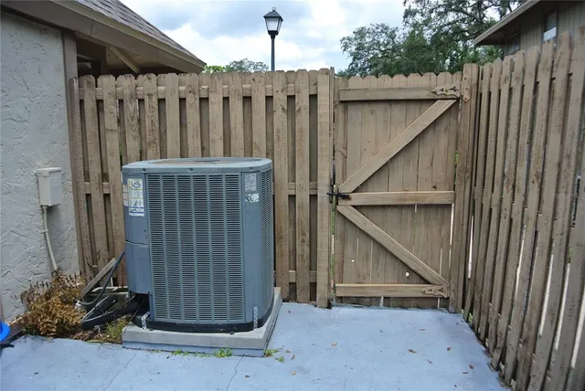 a backyard of a house with barbeque oven