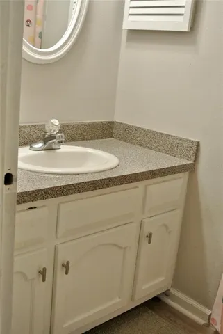 a bathroom with a toilet and a sink