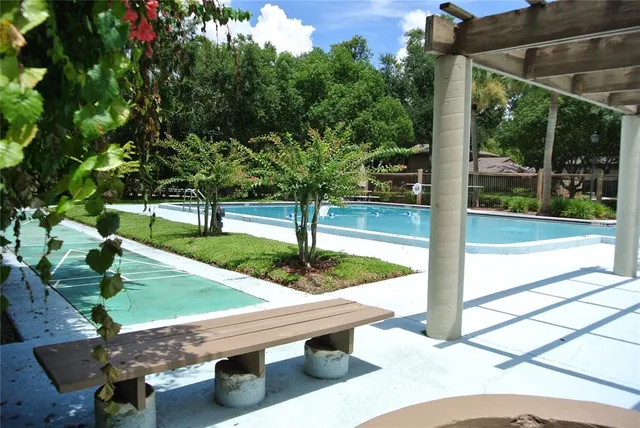 a room with a bench and painted walls