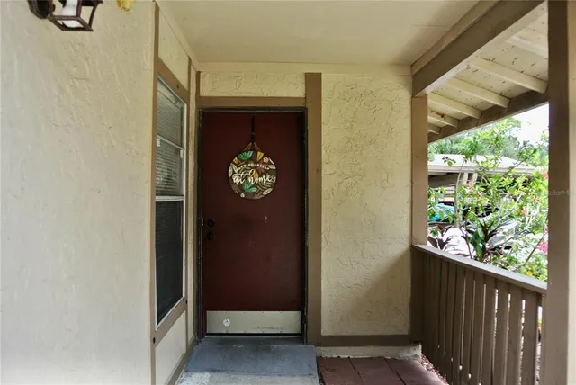 a wooden door with a wooden fence