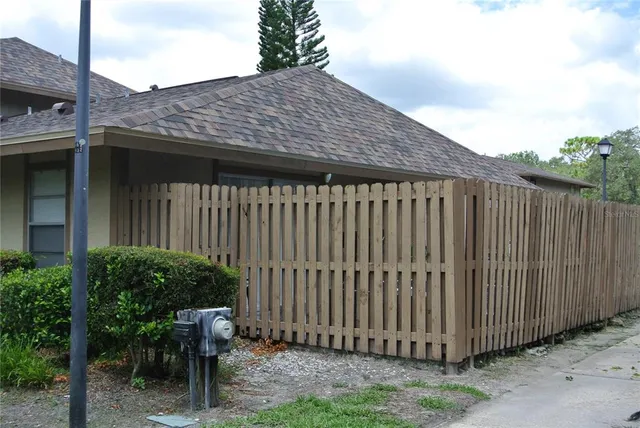 a backyard of a house with seating space