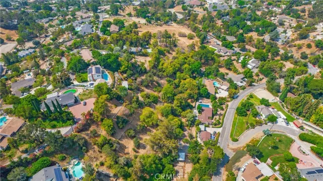 an aerial view of residential houses with yard