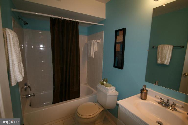 18107 Coachmans Road Germantown, MD 20874 - Photo 13 of 21 a bathroom with a sink toilet and shower