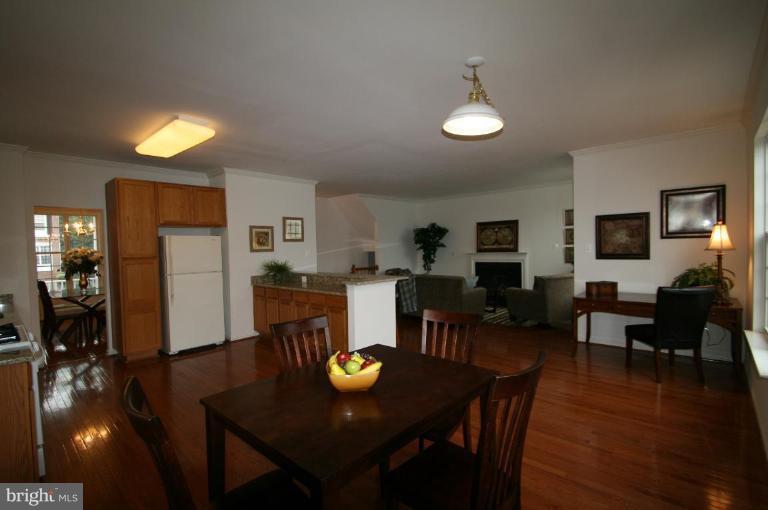 18107 Coachmans Road Germantown, MD 20874 - Photo 5 of 21 a view of a dining room with furniture and wooden floor