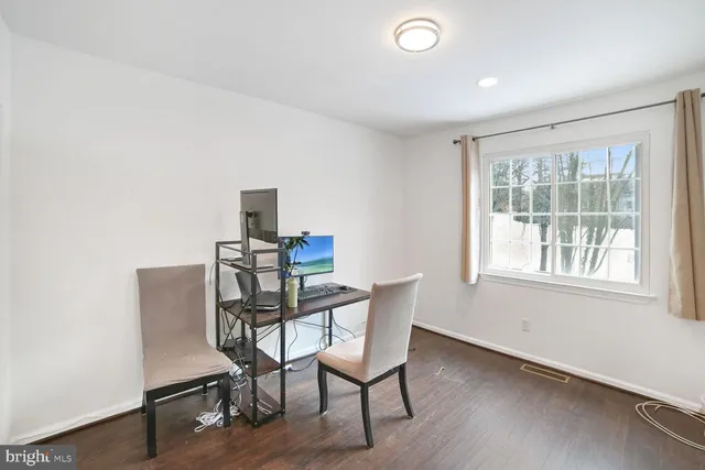 a workspace with furniture and wooden floor