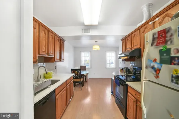a kitchen with stainless steel appliances granite countertop lots of counter top space and furniture