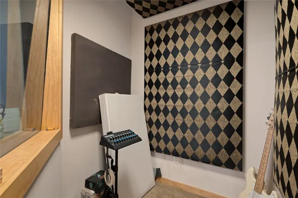 a bathroom with a toilet and a shower curtain