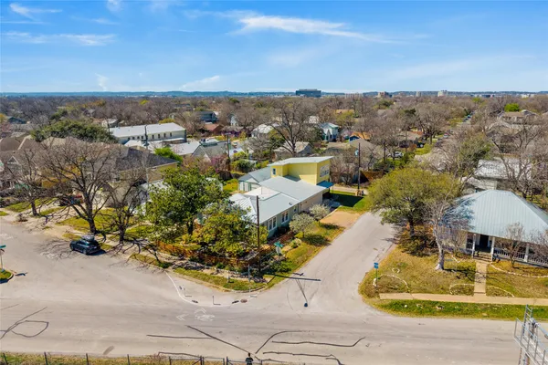 an aerial view of a house with a swimming pool
