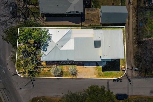an aerial view of a house with swimming pool