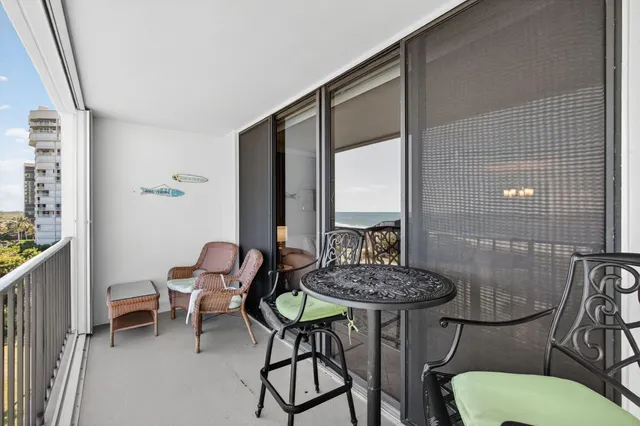 a view of a room with furniture and a potted plant