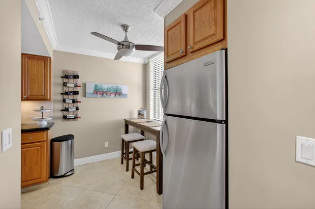 a kitchen with stainless steel appliances a refrigerator and a sink
