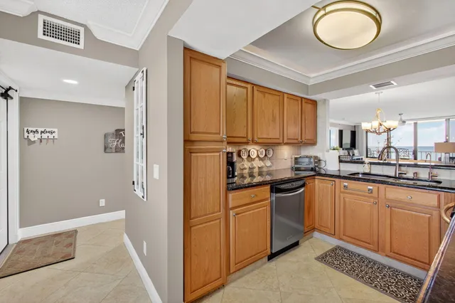a kitchen with cabinets and stainless steel appliances