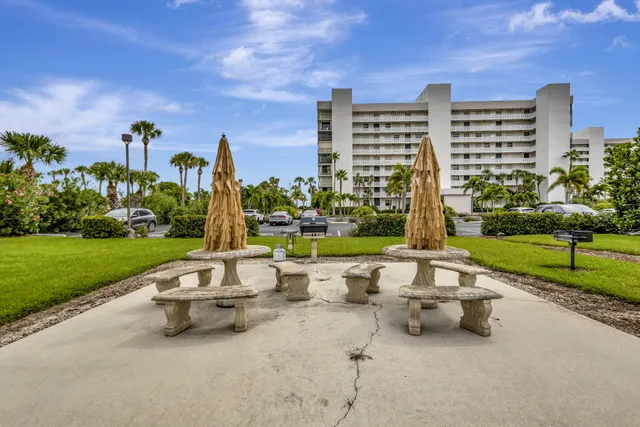 a view of a city with tall buildings and ocean view