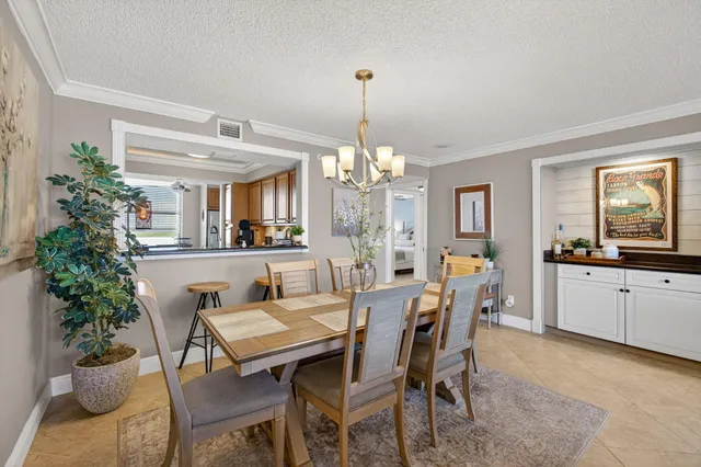 a view of a dining room with furniture and window
