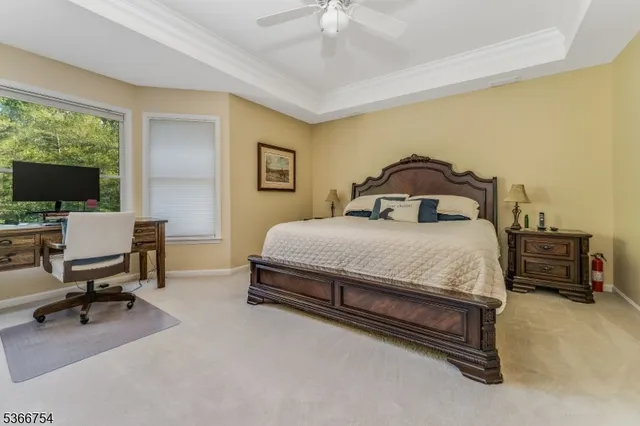 a bedroom with a bed a desk and chair